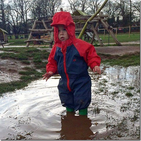 Archie puddle jumping in his Togz suit