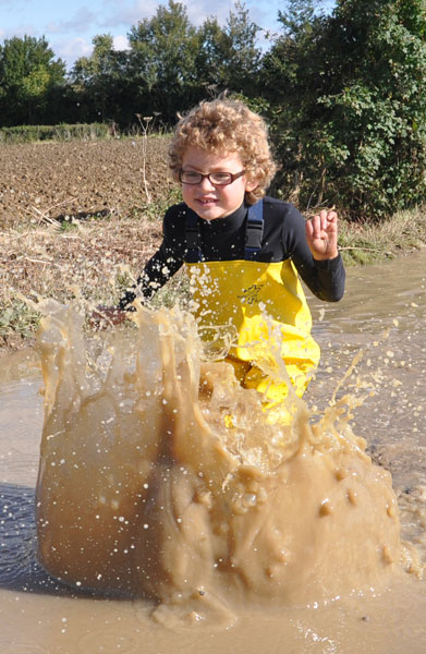 Felix, enjoying the excitement of muddy puddles (and puddle-proofed in our waders!)