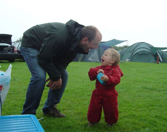 Finn's first camping trip - thank goodness for the Puddle Suit!