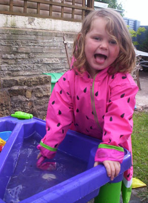 Jessica F having fun in her Wippette Kids Watermeon raincoat