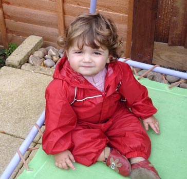 Katie J on her trampoline in Regatta Puddle Suit