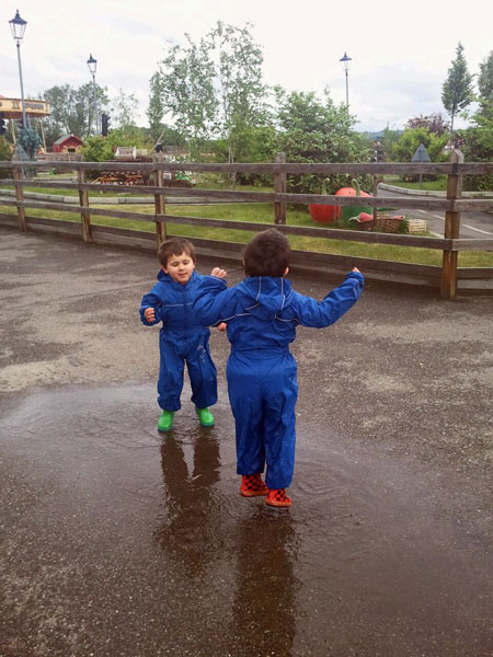 Micah & Eben having fun in puddles