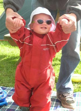 Archie in his Puddle Suit working on his walking!