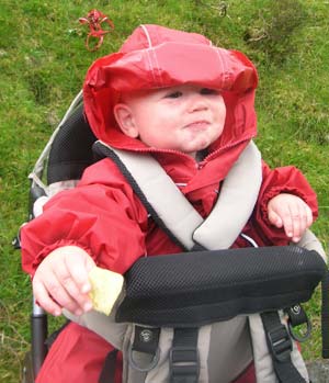 Archie in Puddle Suit and back pack