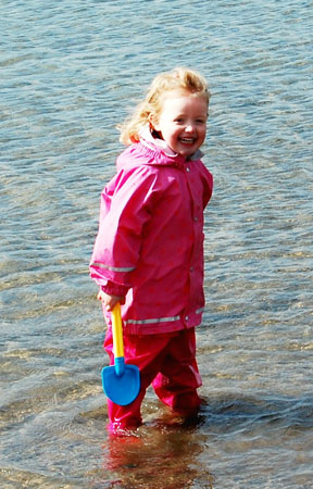 Eilidh playing in her Kiba print jacket and dungarees