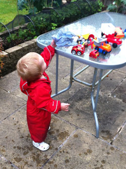 outdoor play in puddle suit