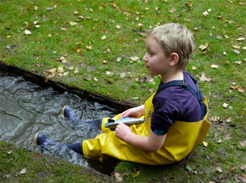 Sandy having fun in kids waders