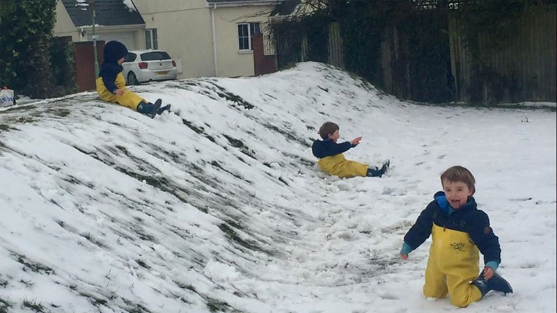 Triplets Snow play in waders