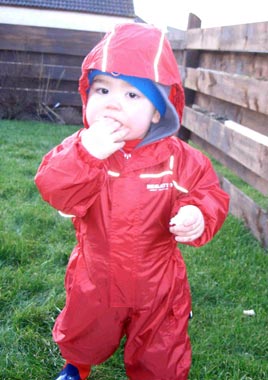 Leo 'feeding the birds' in his regatta Puddle Suit