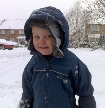 Matai in puddle suit and Lugs hat