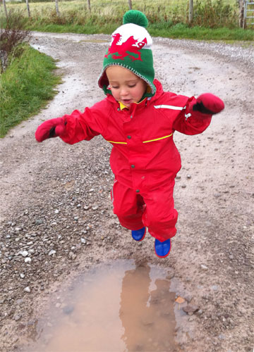 Owen's son puddle jumping in his Kiba suit and Snowstopper mitts